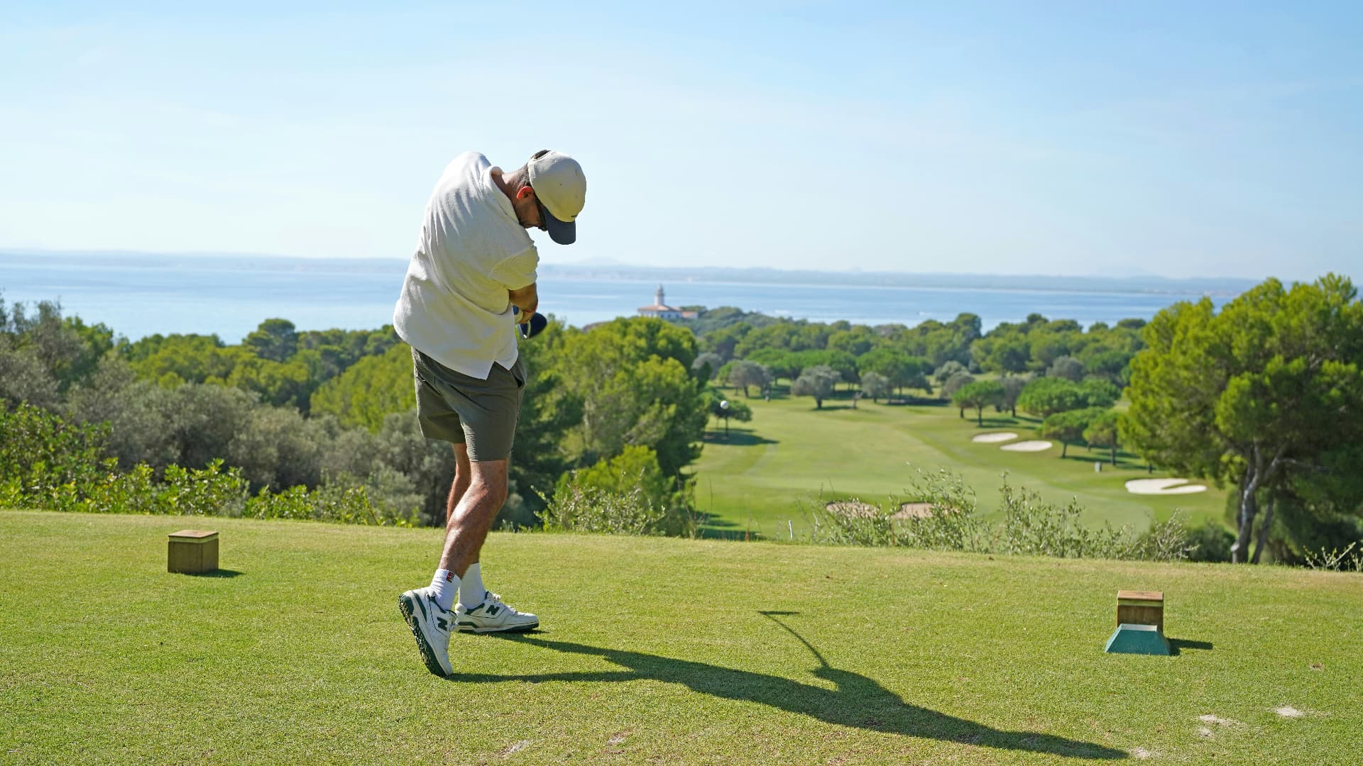 Golfer playing a coastal course overlooking the sea in Spain